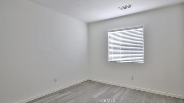 unfurnished room featuring light hardwood / wood-style flooring