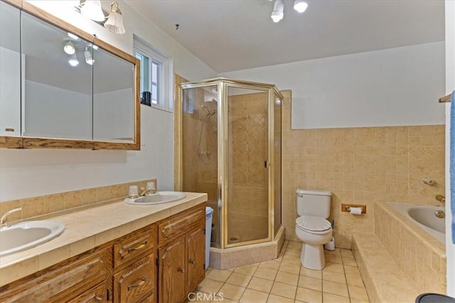 full bathroom with toilet, shower with separate bathtub, tile patterned floors, and vanity