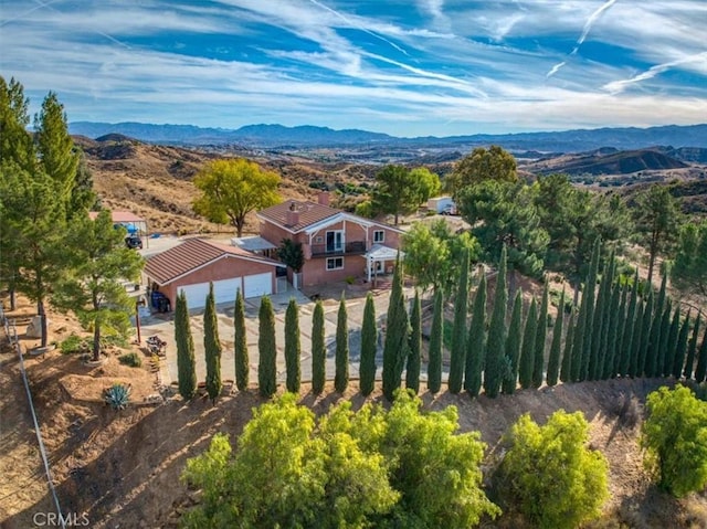 drone / aerial view featuring a mountain view