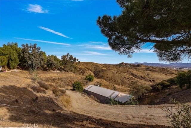 view of storm shelter featuring a mountain view