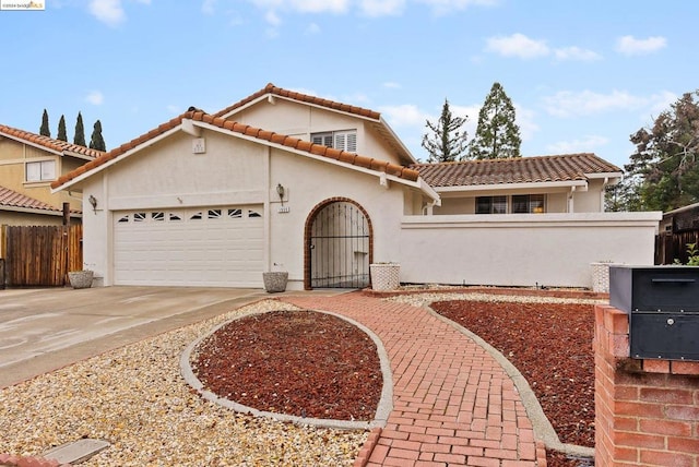 mediterranean / spanish-style home featuring a garage