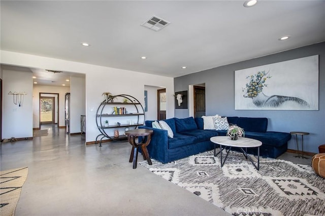 living room featuring concrete floors