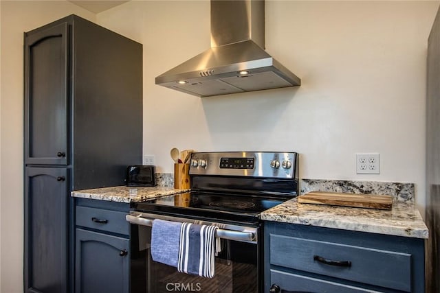 kitchen with light stone countertops, island exhaust hood, and stainless steel range with electric cooktop