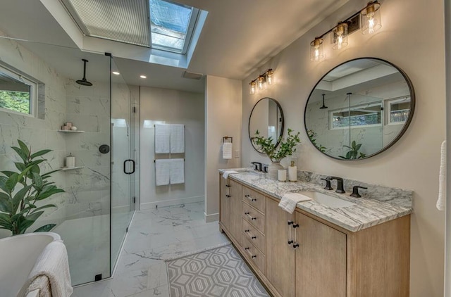 bathroom with walk in shower, vanity, and a skylight