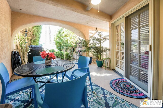 balcony with a patio, a grill, and ceiling fan