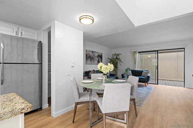 dining area with light wood-type flooring