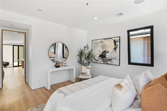 bedroom with light hardwood / wood-style floors