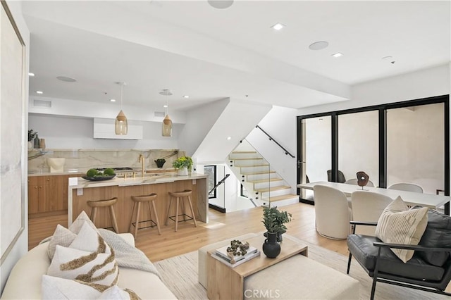 living room with light hardwood / wood-style floors