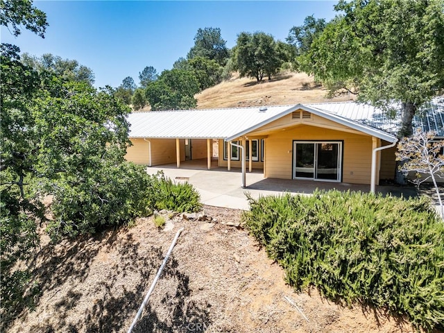 back of property with a patio area