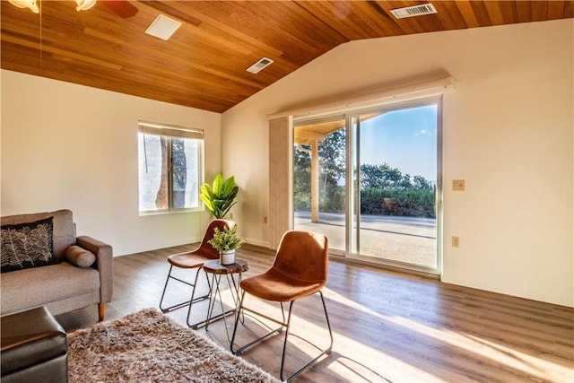 living area with ceiling fan, wood ceiling, lofted ceiling, and hardwood / wood-style flooring