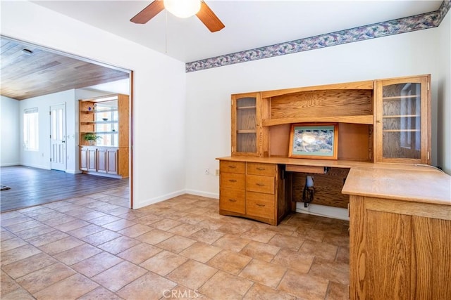 unfurnished office featuring ceiling fan