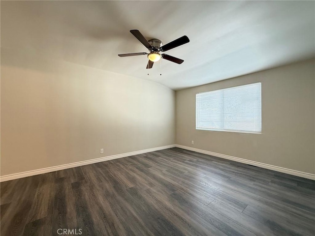 spare room featuring ceiling fan and dark hardwood / wood-style flooring