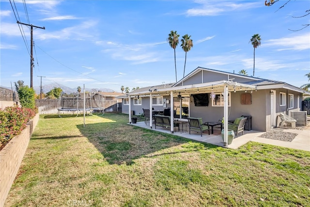 view of yard featuring a patio area and a trampoline