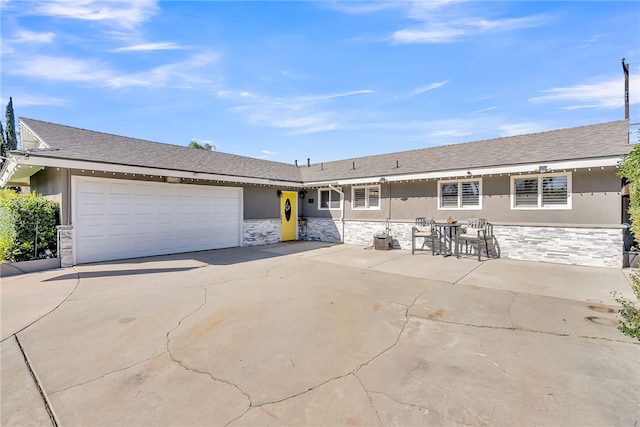 ranch-style home featuring a garage