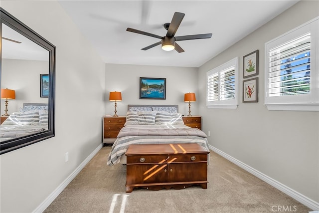 bedroom featuring light carpet and ceiling fan