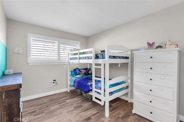 bedroom with hardwood / wood-style flooring