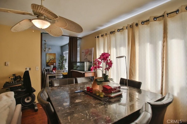 dining area with a chandelier and dark hardwood / wood-style floors