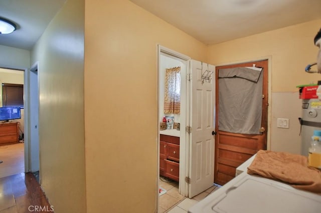 interior space with washer and clothes dryer and light hardwood / wood-style flooring