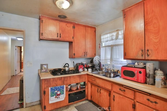 kitchen with sink and black gas stovetop