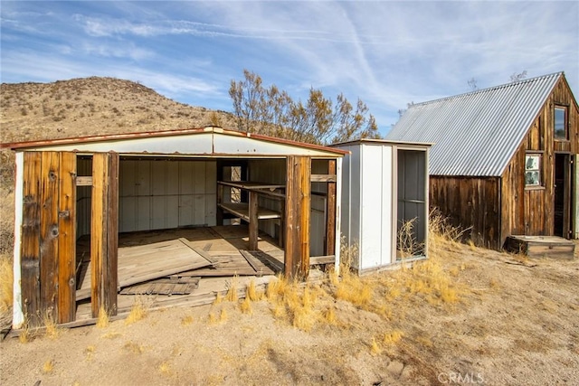 view of outbuilding featuring a mountain view