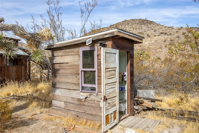 view of outdoor structure with a mountain view