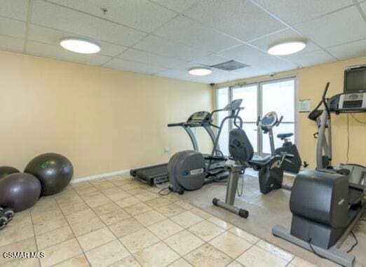 workout room featuring a drop ceiling