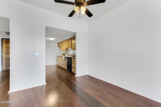 unfurnished living room featuring ceiling fan and dark hardwood / wood-style floors