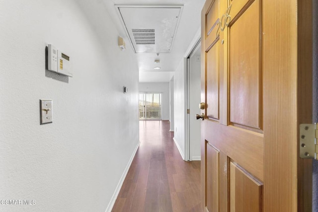 hallway featuring dark hardwood / wood-style flooring