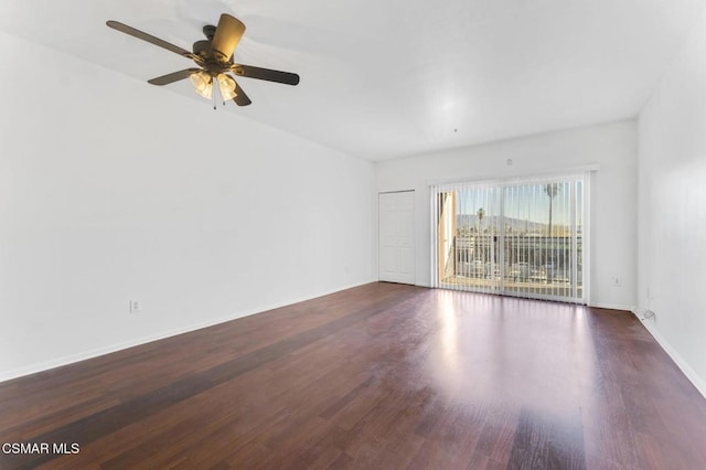 unfurnished room featuring ceiling fan and dark hardwood / wood-style flooring