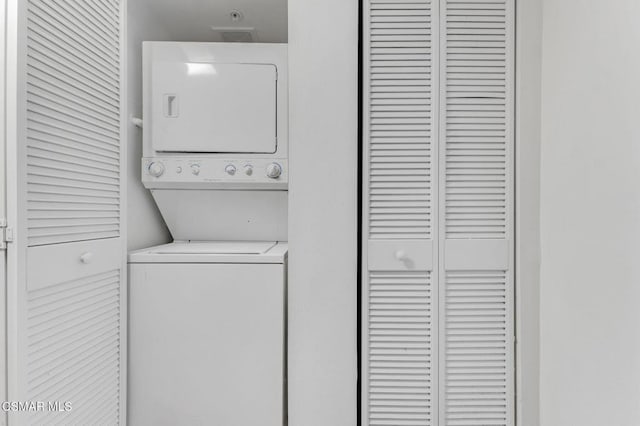 washroom with stacked washer and clothes dryer