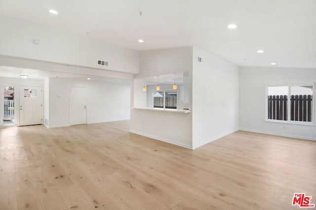 unfurnished living room with light hardwood / wood-style floors