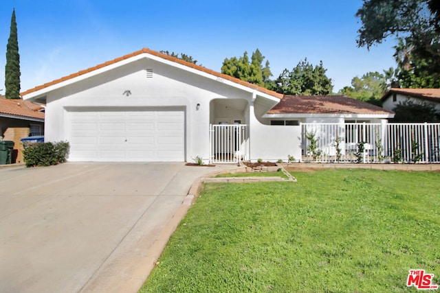 view of front facade with a front lawn and a garage