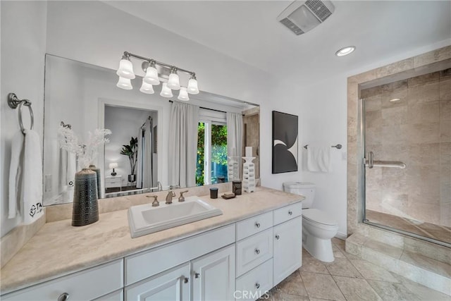 bathroom featuring toilet, an enclosed shower, and vanity