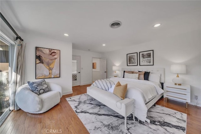 bedroom featuring hardwood / wood-style floors