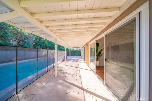 view of patio / terrace with a fenced in pool