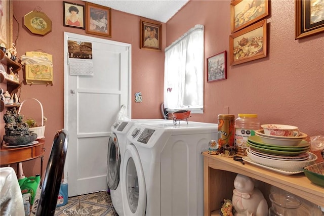 laundry area with washing machine and dryer and tile patterned flooring