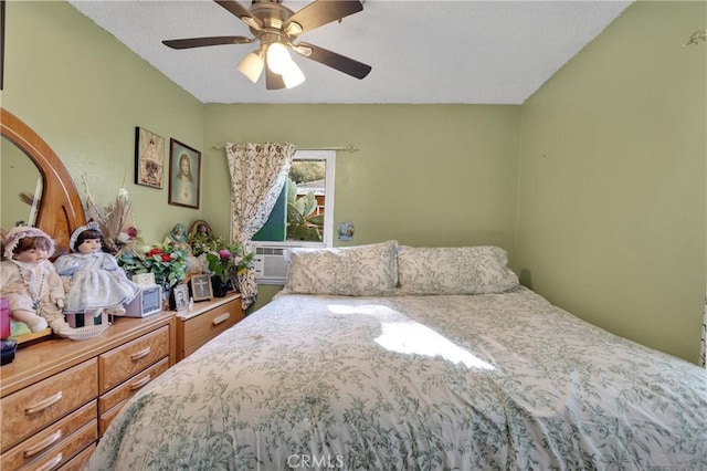 bedroom featuring ceiling fan and cooling unit