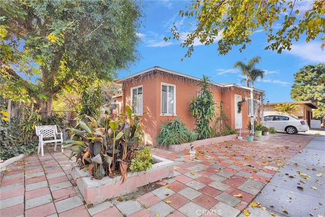 view of front of home featuring a patio area