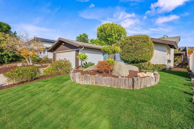 view of front facade with a front lawn and a garage