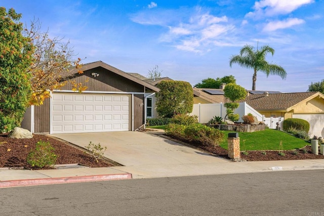 ranch-style house featuring a garage