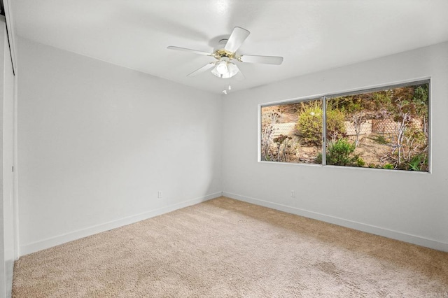 unfurnished room featuring carpet floors and ceiling fan