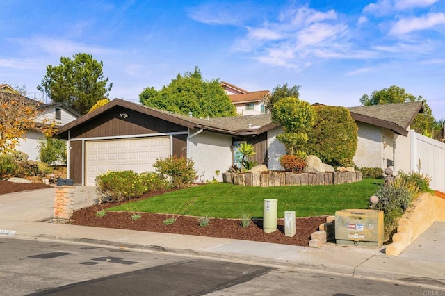 view of front facade with a front yard and a garage