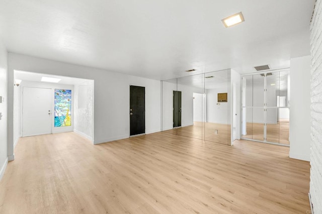 empty room with light wood-type flooring