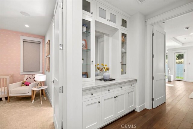 corridor featuring dark hardwood / wood-style floors