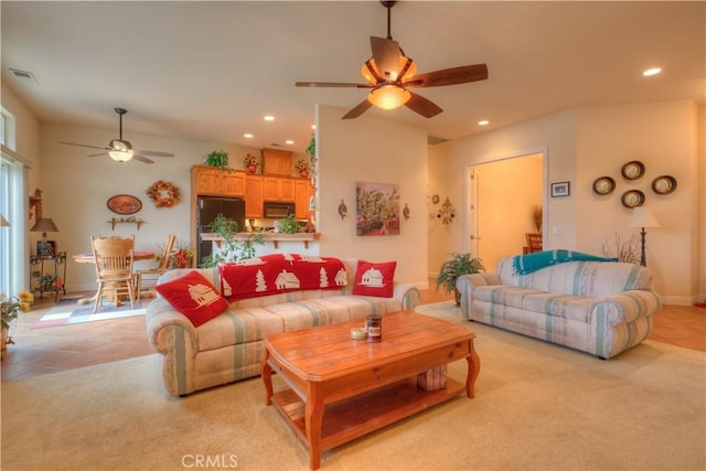 living room with ceiling fan and light tile patterned flooring