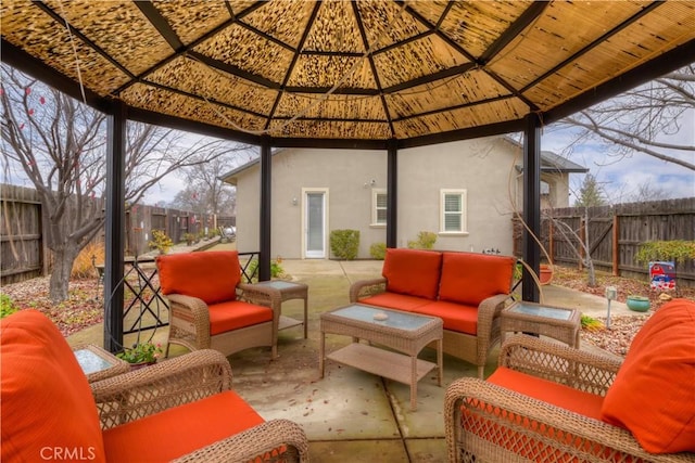 view of patio featuring a gazebo and an outdoor hangout area