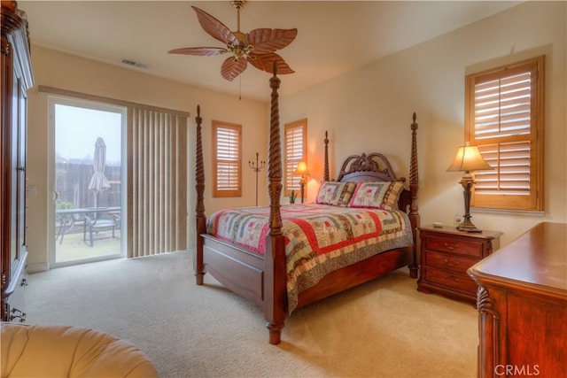 carpeted bedroom with ceiling fan and access to exterior