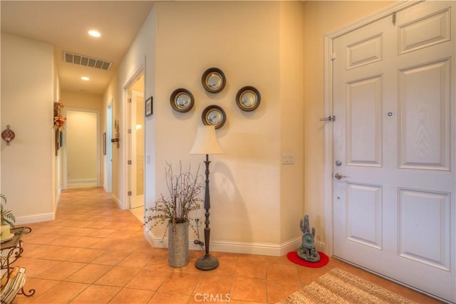 entrance foyer featuring light tile patterned floors