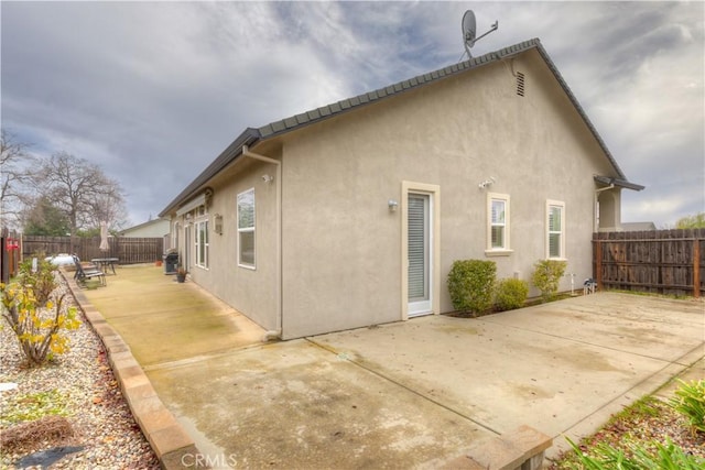 rear view of property with a patio