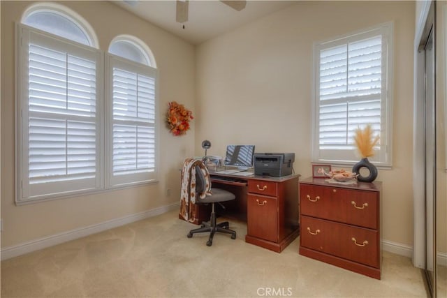 carpeted office with ceiling fan